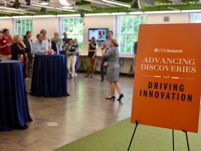 Advancing Discoveries event with sign